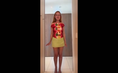 Amelia Dimoldenberg in short skirt and off-shoulder top.