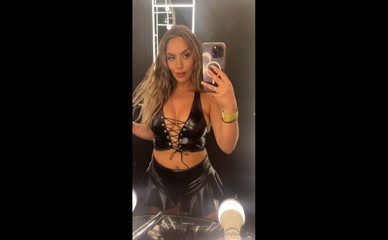 BOOTYQUEENBAE in leather top and skirt.