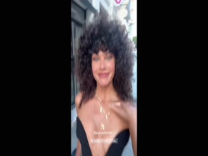 Ariadna Hafez cleavage dress.