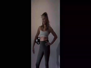 Jennifer Aniston in sports bra and leggings