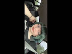 lavenderthief00:00 Person with green hair and facial piercings speaking in car