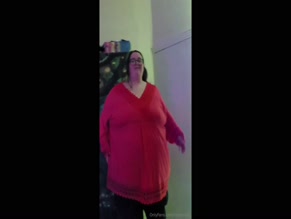ladybrads pulls red top off revealing her huge breasts