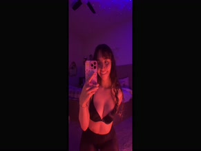 Catlyn Crespo revealing her cleavage in a black bra
