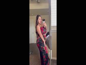 Missidii's floral top slips off, exposing cleavage.