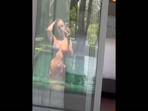 Abbie Chatfield bikini pool selfie.