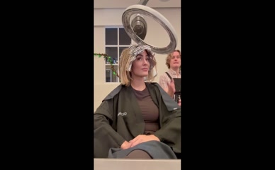 Frankie Bridge in salon robe getting hair done