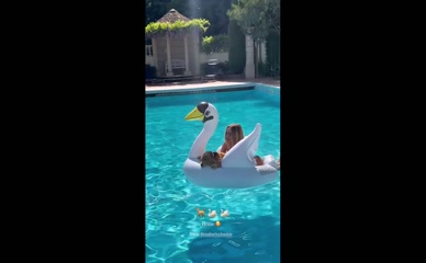 Kimberley Garner bikini pool swan dog.