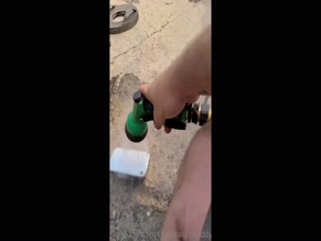 Man sprays hot metal with water.