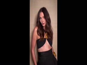 Karlie Kloss in black halter top and pants.