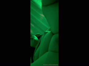 Boredathome1 masturbates in green light.
