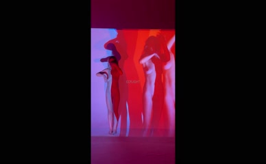 Nude ccflight posing with colored light projections